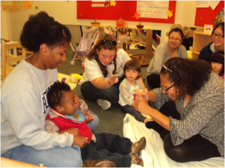 Image of teacher signing with baby